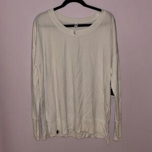 White fleece long sleeve crew neck w/side slits and thumb holes, brand new w/tag